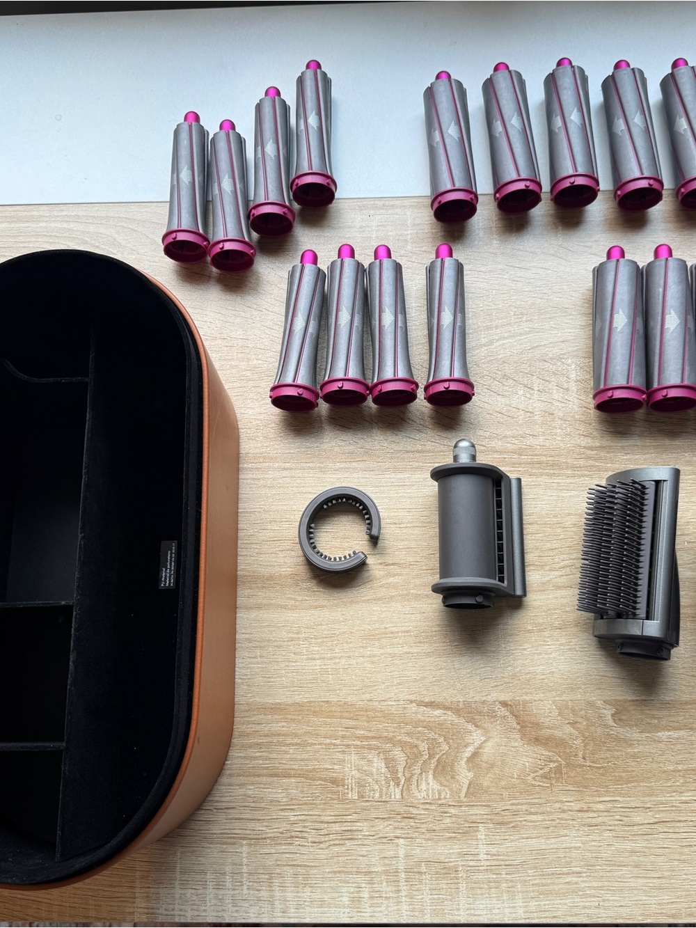 Dyson case and various air flow wrap attachments. Dryer not included